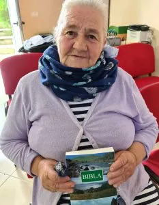 Woman In Albania holding a book