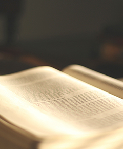 A Bible opened with a dark background