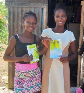 Women holding biblical material