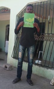 Jean Richard holding a book