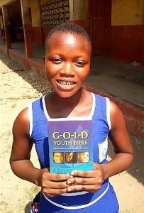Ghana woman holding a book