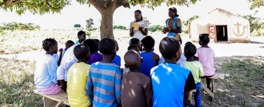 Group of people gather outside a church