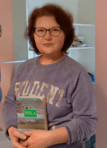 Portrait Of Lumturi, Albanian Living In Italy, With Her Albanian Bible.