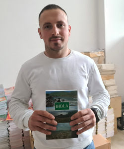 Portrait Of Stiljan Holding An Albanese Bible.