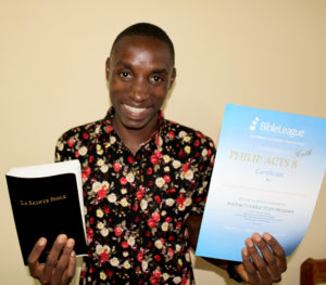 Eloge Excited To Receive His Bible And Certificate