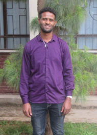 Efrem Standing The Bible League Ethiopia Office