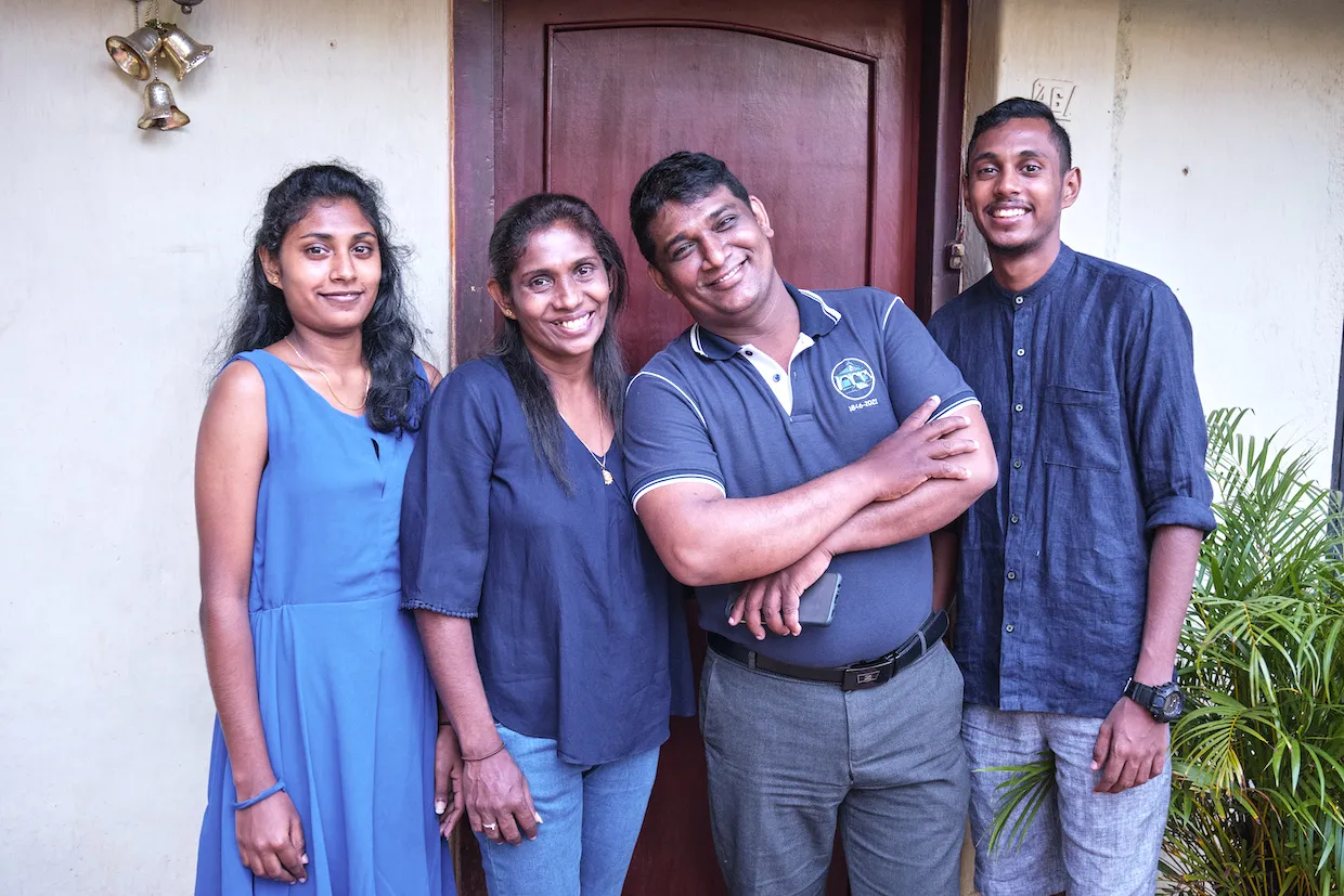 Anne, Inoka, Chaminda, And Roomal At The Front Door Of Their House.
