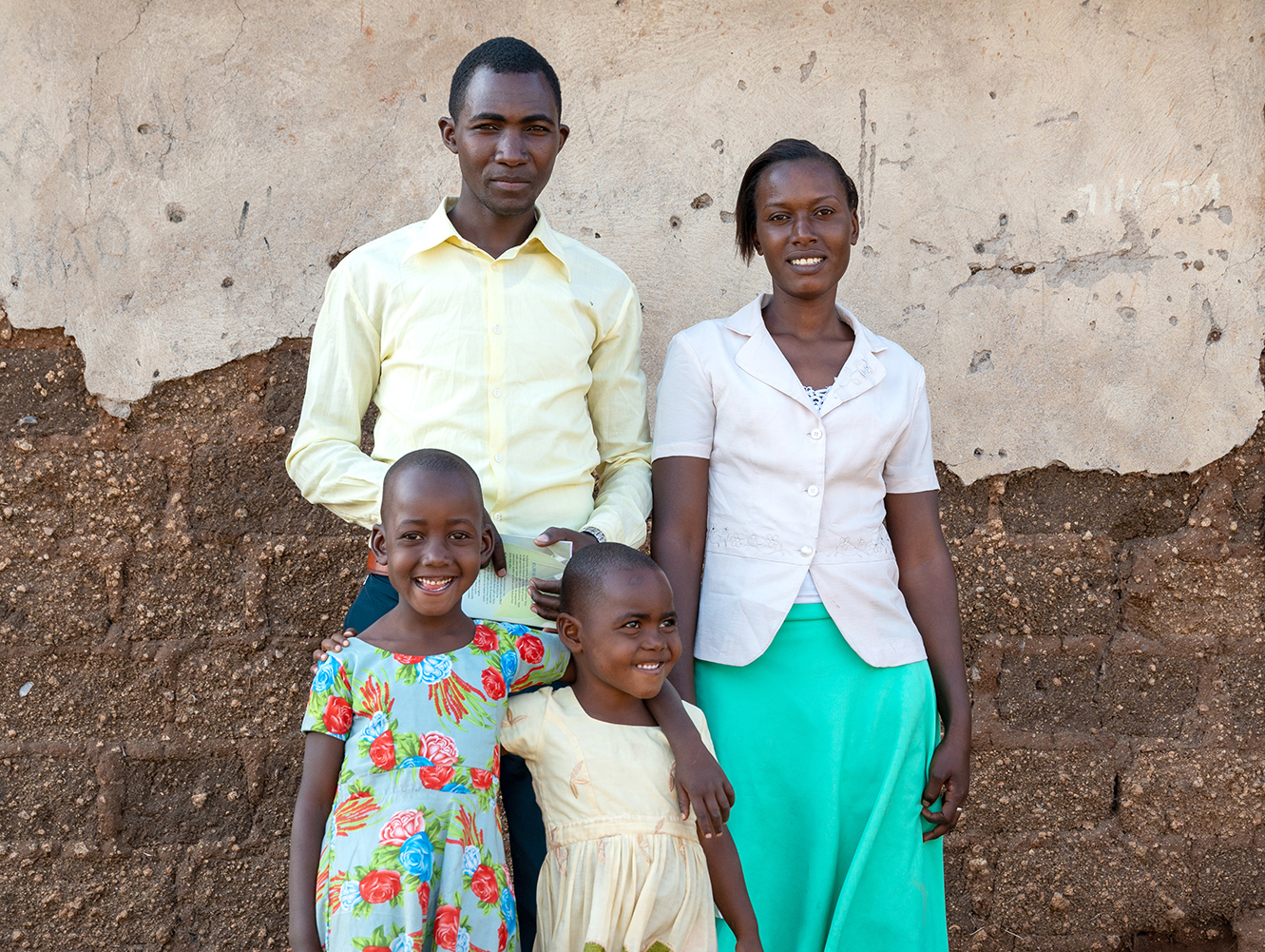 Pastor Jacob And His Family Posing Outside His Church In Idonho.