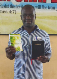 Eric In Prison With His Booklet And Bible