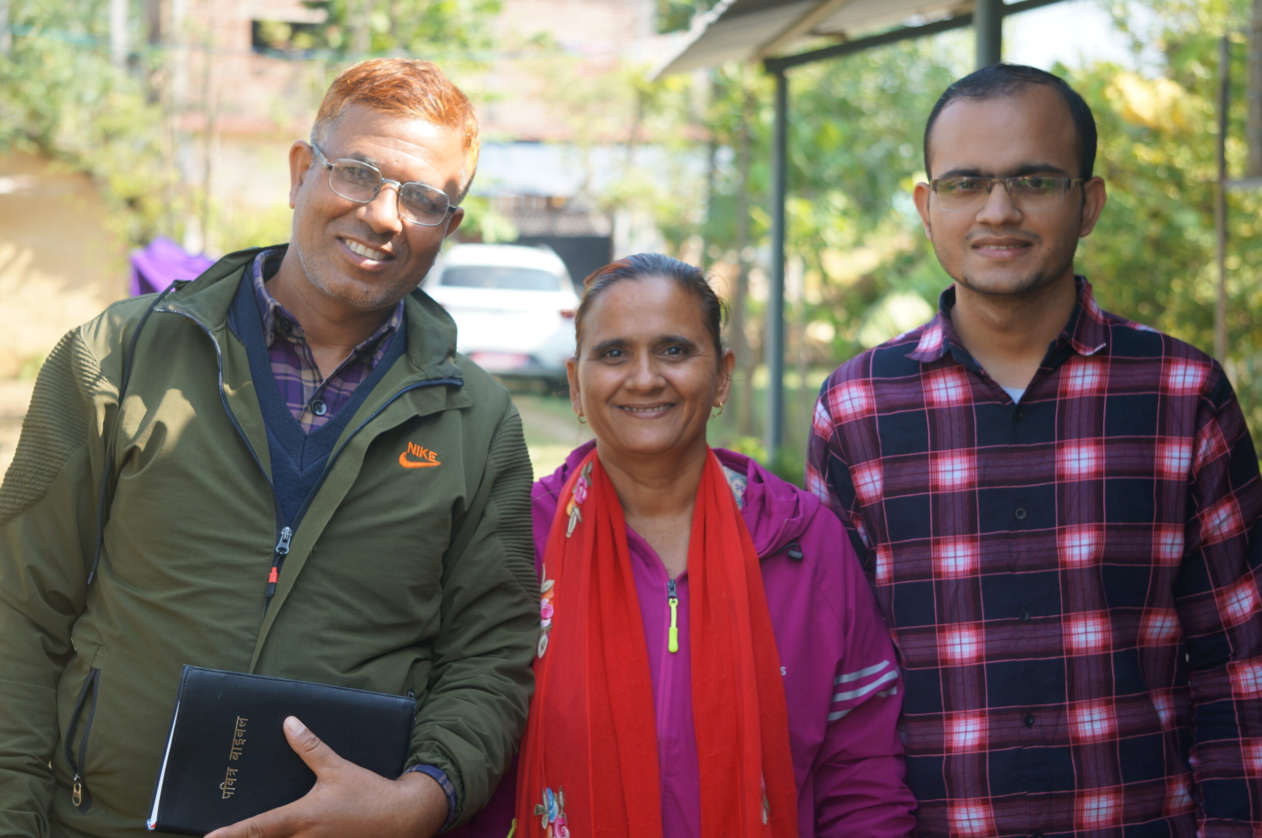 Gangaram (left) with his wife and son.