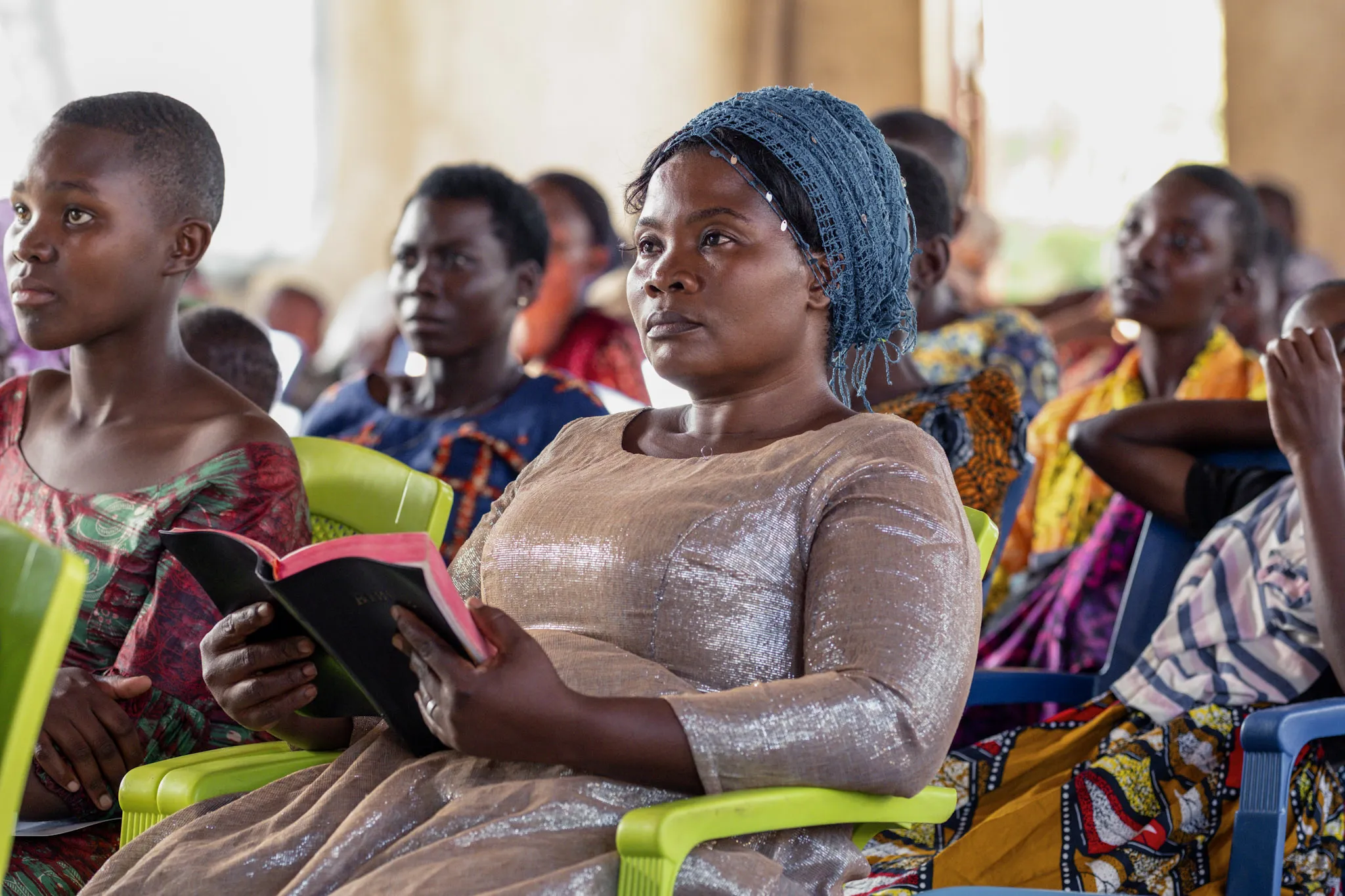 I Christ follower in Tanzania that has been blessed by Bible League. Paying attention to God's Word being read.