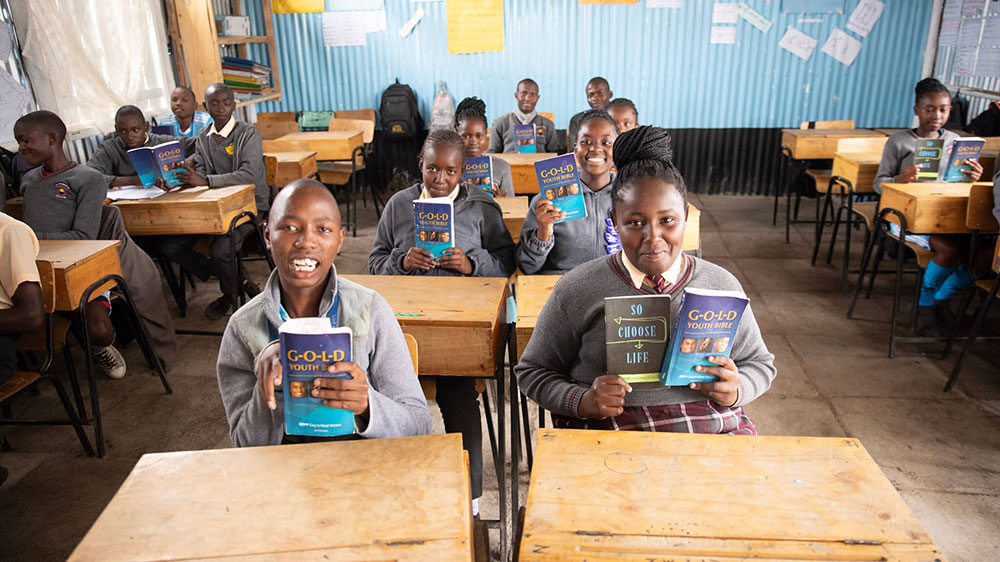 Kenyan children in class with their bibles