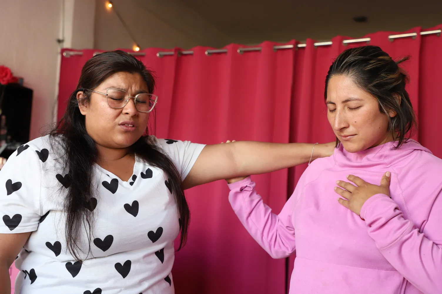 Tania and Jacqueline praying