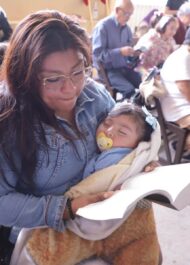 Tania in church reading her bible